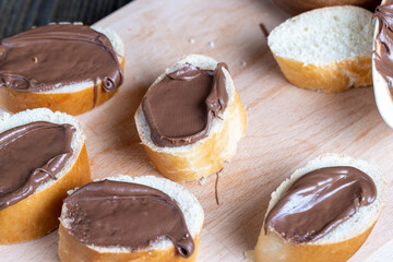 Chocolate butter spread on bread while cooking breakfast