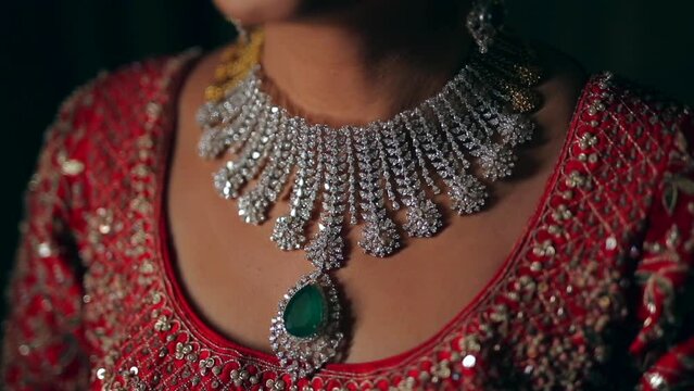 A Shot of an Indian Bride showing her Bridal Jewellery at her Indian Wedding in India