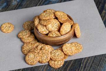 oatmeal thin round cookies with lots of sesame seeds