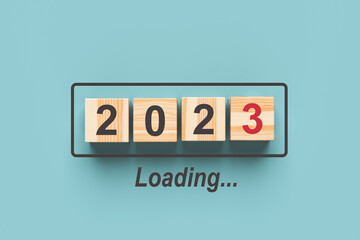 2023 new year loading. Wooden cubes with 2023 on a blue background. 3d rendering.