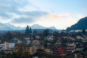 Fototapeta na wymiar Nice scape of Thun city and Mt.Niesen from Spiez Castle and Tower on the hills near Lake Thun during autumn , winter morning : Spiez , Switzerland : December 4 , 2019