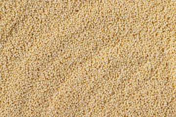 Fresh raw porridge couscous from wheat or millet