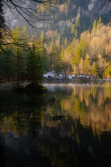 Blausee , beautiful turquoise nature lake in Bernese Oberland, Kandergrund during autumn , winter morning : Blausee , Switzerland : December 4 , 2019