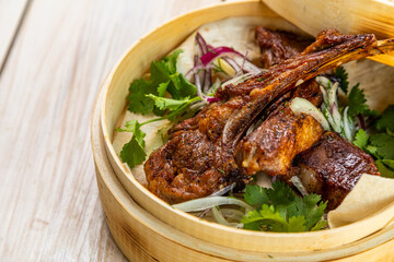 grilled lamb ribs with fresh vegetables and lavash