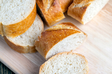 sliced into pieces a long baguette with a crispy crust