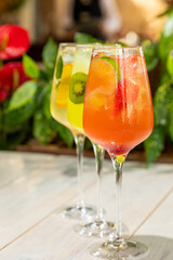 fresh lemonades from different fruits in a glass