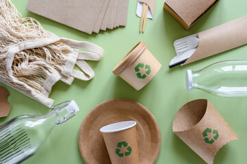 The concept of zero waste and recycling. Top view of eco friendly items and paper packaging with...