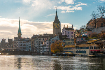 Fototapeta premium Beautiful view along Limmat river , Limmatquai in the center of Zurich during autumn , winter cloudy day : Zurich , Switzerland : December 6 , 2019
