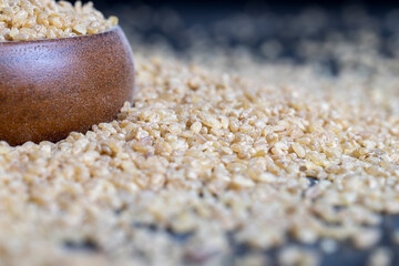 Fresh uncooked bulgur porridge on the table