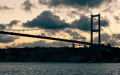 Sunset on the bosphorus bridge in istanbul with clouds