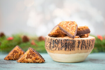 Nut corner triangles, traditional german sweets called Nussecke, covered with chocolate, christmas cake
