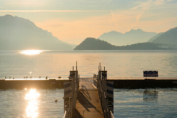 Menaggio , beautiful town on the shore of Lake Como , Lombardy .  during autumn , winter sunny day : Lake Como , Italy : December 7 , 2019