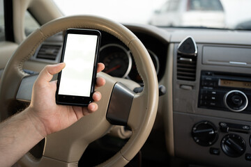 man using mobile smart phone, checking address location via navigator application, driving a car. Driver hand holding smartphone white screen mockup