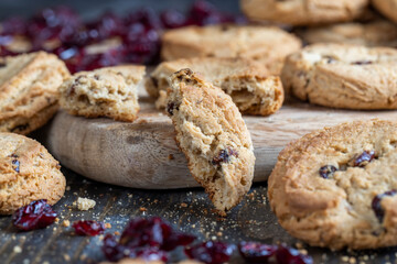 delicious dried cookies made of high-quality flour with dried red cranberries on the table
