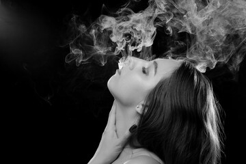 woman blowing smoke