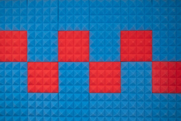 Acoustic foam panel background with red and blue lighting. Music background