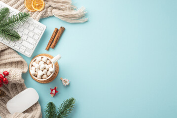 Obraz na płótnie Canvas Top view photo of keyboard computer mouse plaid cup of hot drinking with marshmallow spruce branches decorative clips mistletoe cinnamon sticks dried citrus slices on isolated pastel blue background