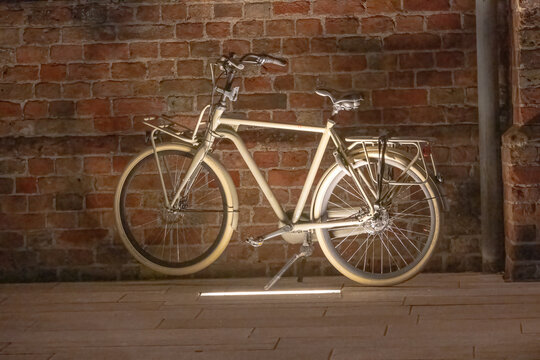 old bicycle on the street in the evening with light
