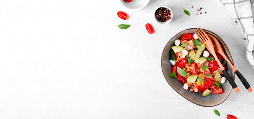 Web banner with salad with quinoa, avocado, cherry tomato, grilled pepper and mozzarella in bowl on white. Healthy meal with various ingredients. Mockup with copy space