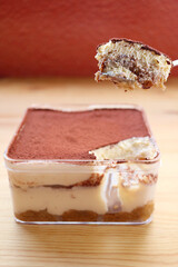 Closeup of a Spoon Scooping Mouthwatering Tiramisu or Tuscan Trifle