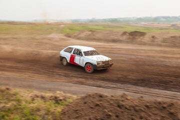 Plakat Rally off-road car make a turn with the clouds and splashes of sand, gravel and dust during rally championship