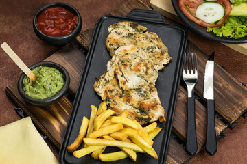 World Food Day, grilled chicken breast with french fries in dining room, healthy food