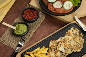 World Food Day, grilled chicken breast with french fries in dining room, healthy food