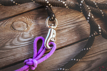 Ropes on a wooden background. Riding equipment close up