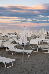 Lido di Venezia Beach in Venice, Italy on a Summer Evening at Dusk with Parasols and Beach Chairs