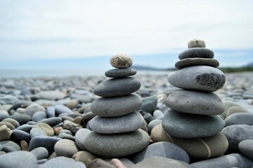 Fototapeta na wymiar Zen towers on a stony beach.