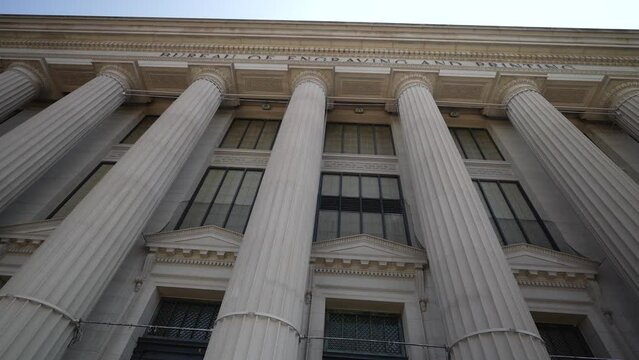 Front facade of the Bureau of Engraving and Printing in Washington, DC part of the Department of the Treasury with blue sky.