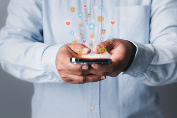 Social media and digital online concept, Woman using smart phone with Social media. The concept of living on vacation and playing social media. Hand pressing love, like, happy icons concept.