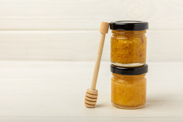 Pistachio honey on white texture wood. Assorted honey. Honey in pistachios and almonds. Environmentally friendly product. Vitaminized jam. Cold remedy.Copy space