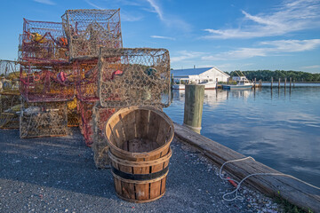 Crab pots and baskets along a Chesapeake Bay jetty. - obrazy, fototapety, plakaty