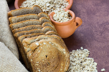 meal organic whole grain sliced ​​bread with oats on dining room