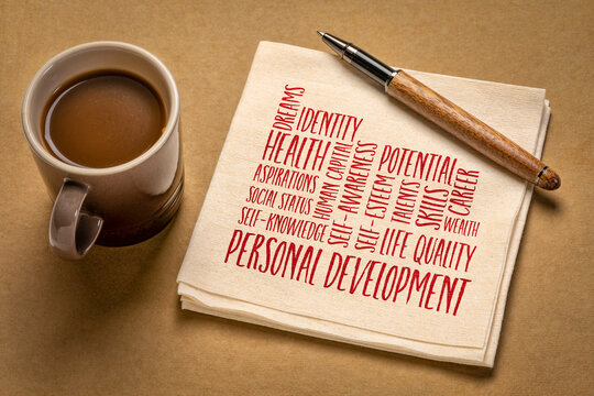 personal development word cloud on a napkin, flat lay with coffee, self improvement concept