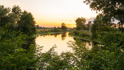 Fototapeta na wymiar oxbow lake of Warta river at sunset, Wymysłów, Poland