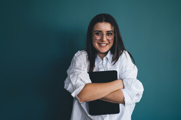 Charming female student with gadget in hands