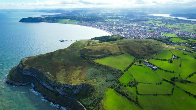 The Great Orme and Llandudno, North Wales, UK. Aerial views of the Welsh landscape from the Great Orme. Green hill tops above Llandudno.