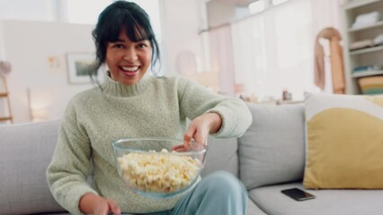 Relax, popcorn and woman watching tv or movie for chill self care leisure time alone in home on sofa. Television channel program decision and streaming choice with snack for weekend entertainment