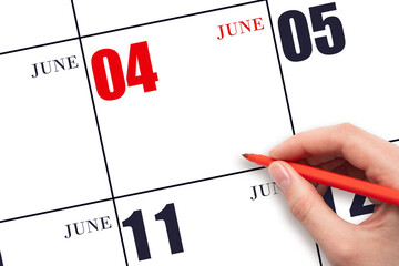 A hand holding a red pen and pointing on the calendar date June 4. Red calendar date, copy space, mockup.