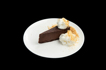 Chocolate dessert in a plate on a black background.