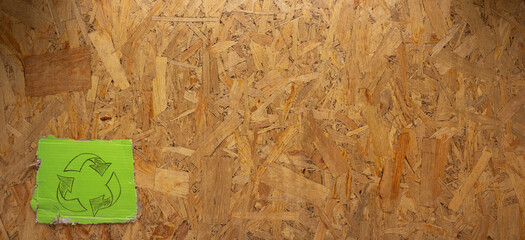 Recycle symbol on  chipboard OSB background texture. Recycling idea concept