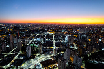 Fototapeta premium Central region of the City of Campinas with buildings, avenues and cars in the early evening. Francisco Glicério Avenue, Orosimbo Maia Avenue and City Hall area.