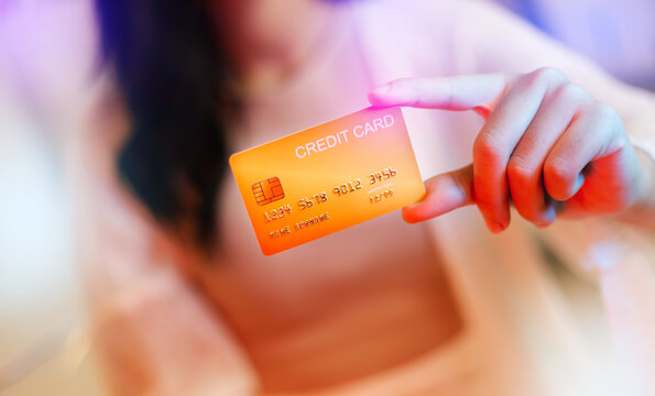 Close up view, young asian woman using creadit card to conduct online financial transactionsand, Concept people using digital wallet for pay in odering product, colorful light background