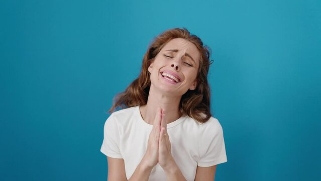 Young beautiful hispanic woman doing please gesture with hands over isolated blue background
