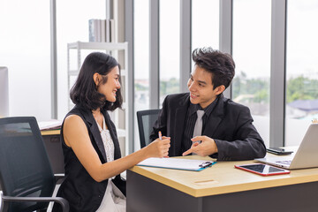 Fototapeta premium Businessman and businesswoman meeting, discussing and working together at the office.
