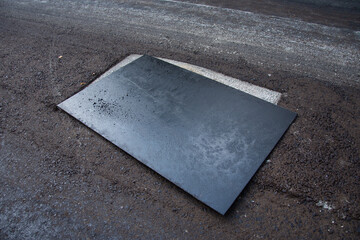rectangular sheet metal cover on a cement channel, in Romania 2022