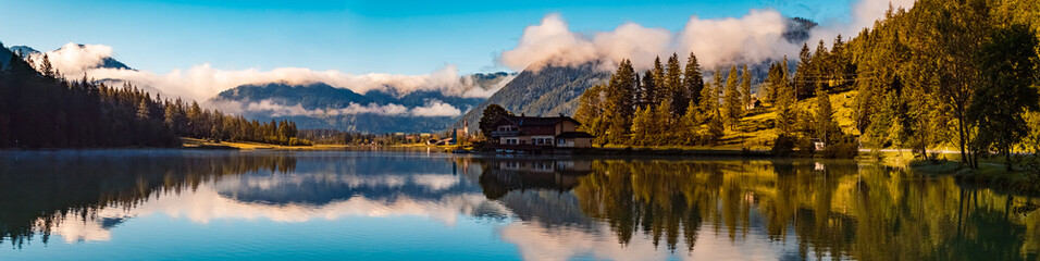 High resolution stitched panorama with reflections at the famous Pillersee lake near Saint Ulrich,...