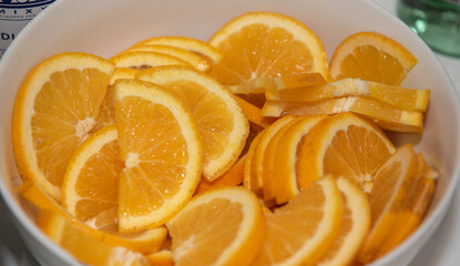 Naklejka na ściany i meble Sliced Citrus aurantiifolia lime in a plastic bowl